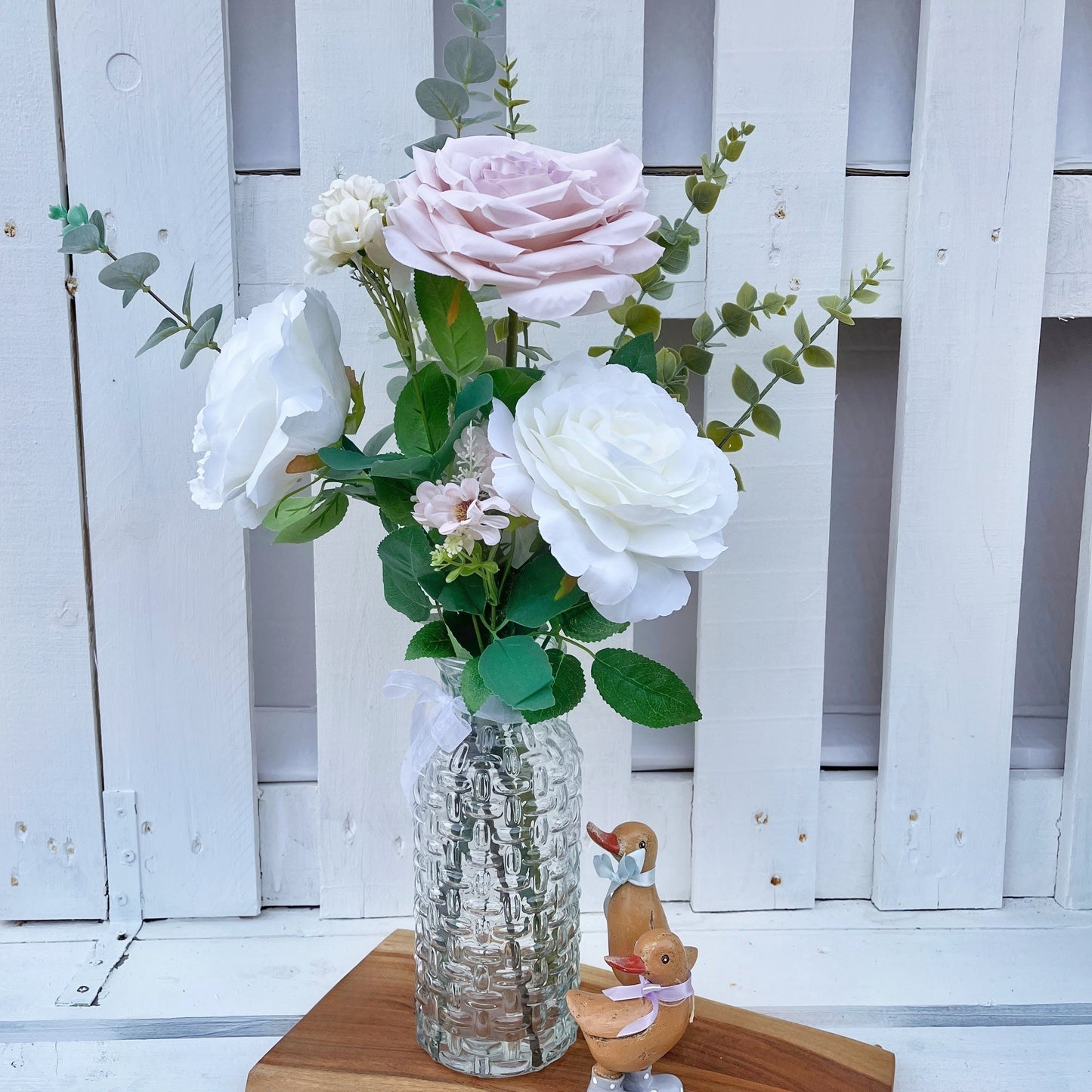 Marie Arrangement in a decorated glass vase
